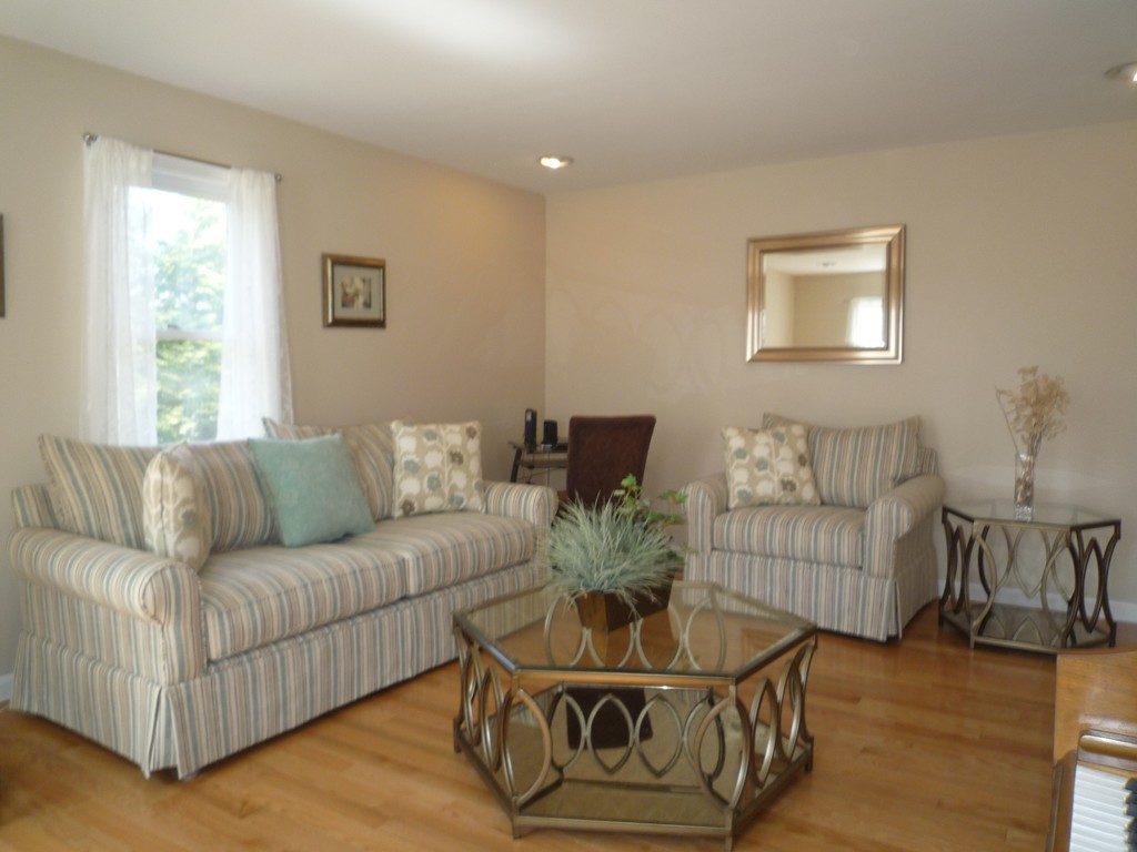 100 Highcrest Road Fall River, MA 02720 - Photo 9 of 30 a living room with furniture and a wooden floor