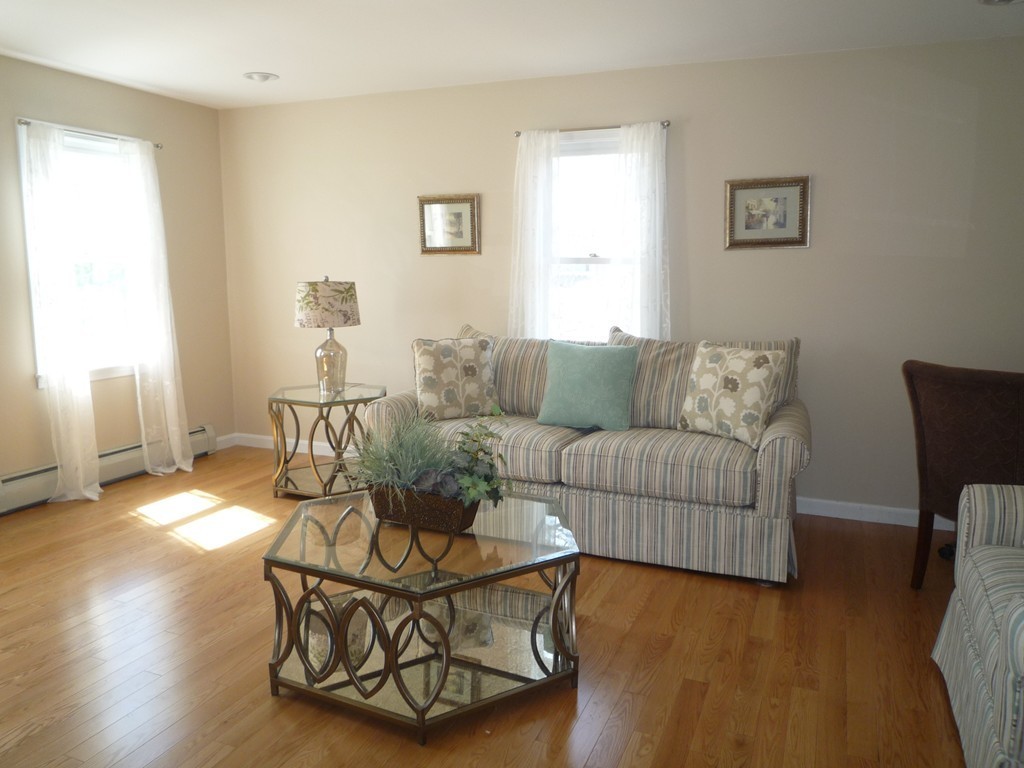 100 Highcrest Road Fall River, MA 02720 - Photo 10 of 30 a living room with furniture and wooden floor