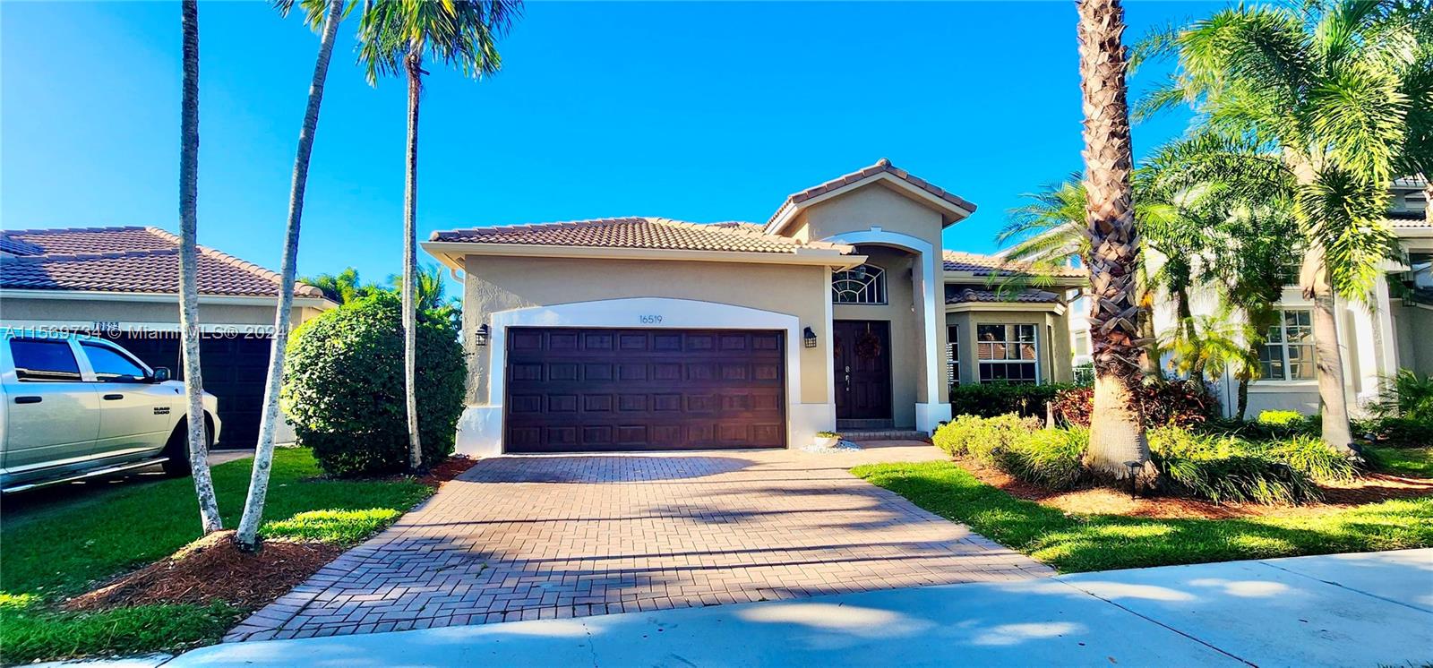 16519 Ruby Lake, Unit 16519 Weston, FL 33331 - Photo 1 of 24 a front view of house with yard and green space