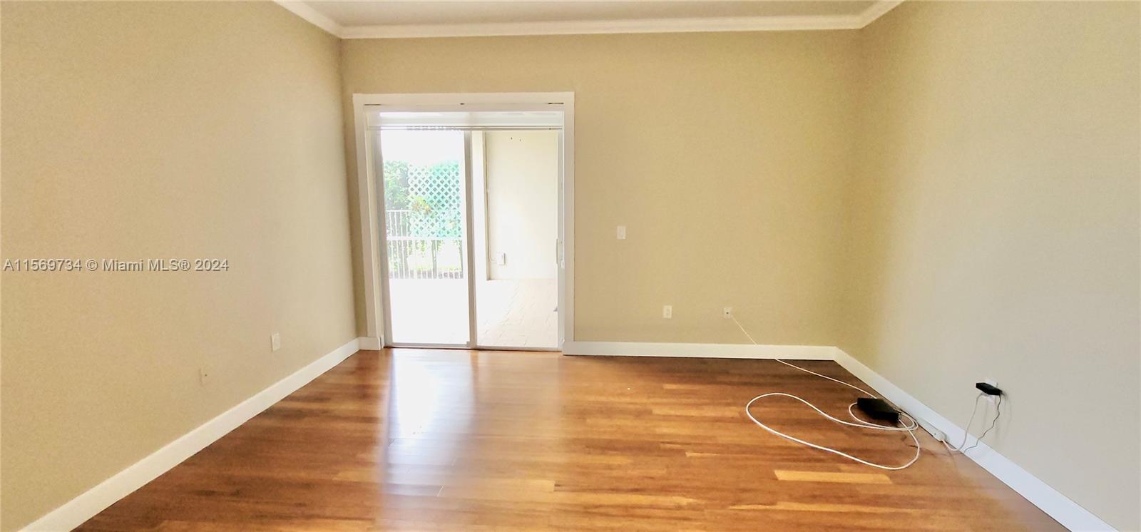 16519 Ruby Lake, Unit 16519 Weston, FL 33331 - Photo 11 of 24 a view of a room with wooden floor and a window