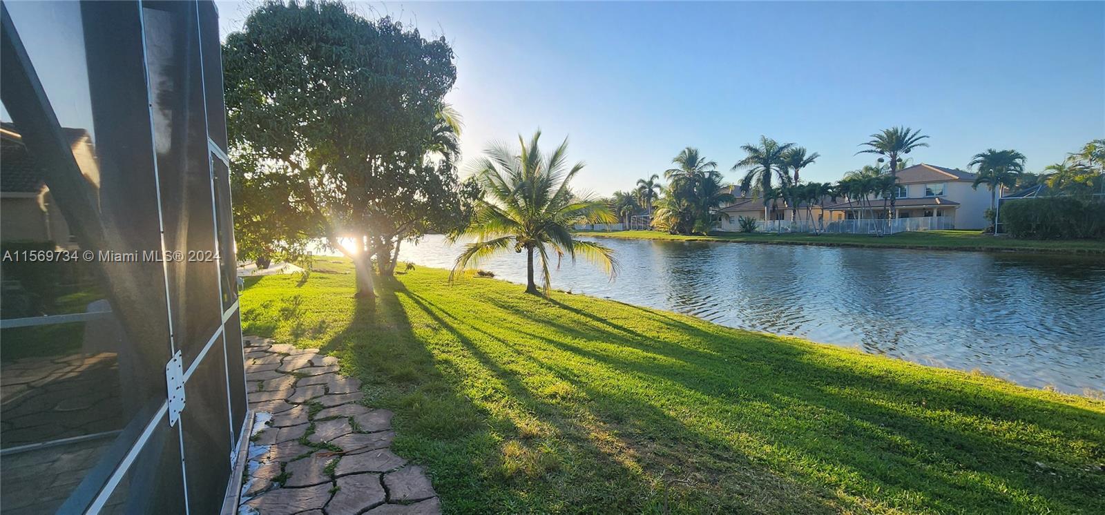 16519 Ruby Lake, Unit 16519 Weston, FL 33331 - Photo 21 of 24 a view of a lake in a backyard