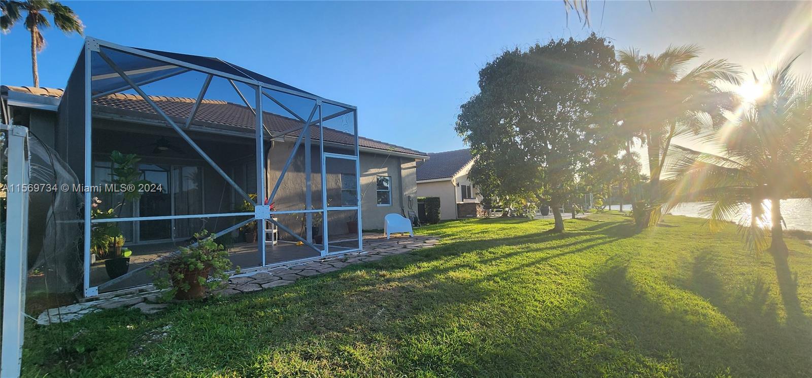 16519 Ruby Lake, Unit 16519 Weston, FL 33331 - Photo 22 of 24 a view of a backyard