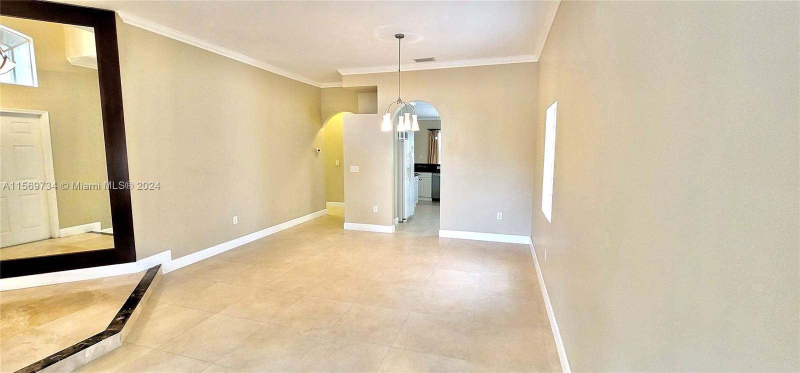 16519 Ruby Lake, Unit 16519 Weston, FL 33331 - Photo 3 of 24 a view of a big room with windows and chandelier