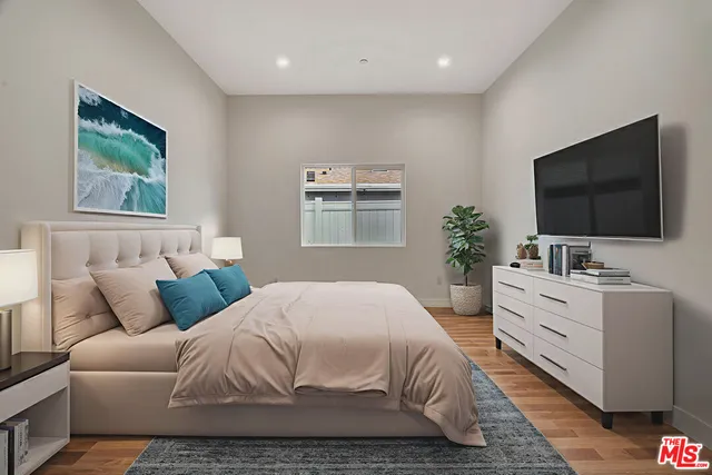 a living room with furniture kitchen view and a table