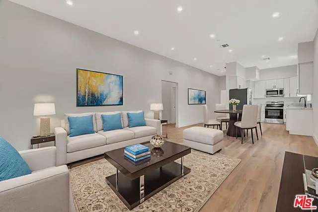 a bedroom with a bed and a flat screen television