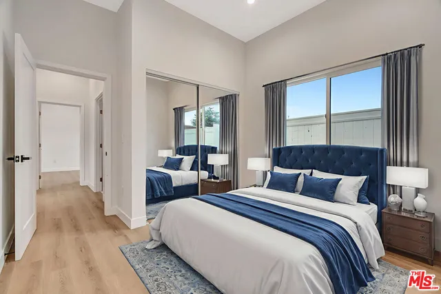 a bedroom with a bed and a couch