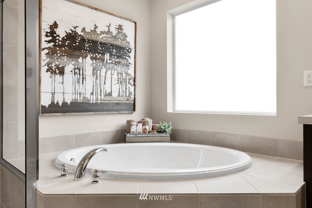 32 211th Street Southeast, Unit P19 Bothell, WA 98021 - Photo 25 of 31 a white bath tub sitting next to a white sink