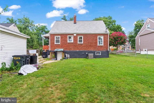 a aerial view of a house with table and chairs in patio