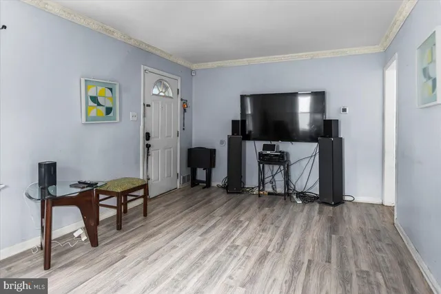 a view of a livingroom with furniture and a flat screen tv