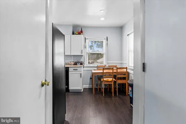 a kitchen with a table and chairs in it