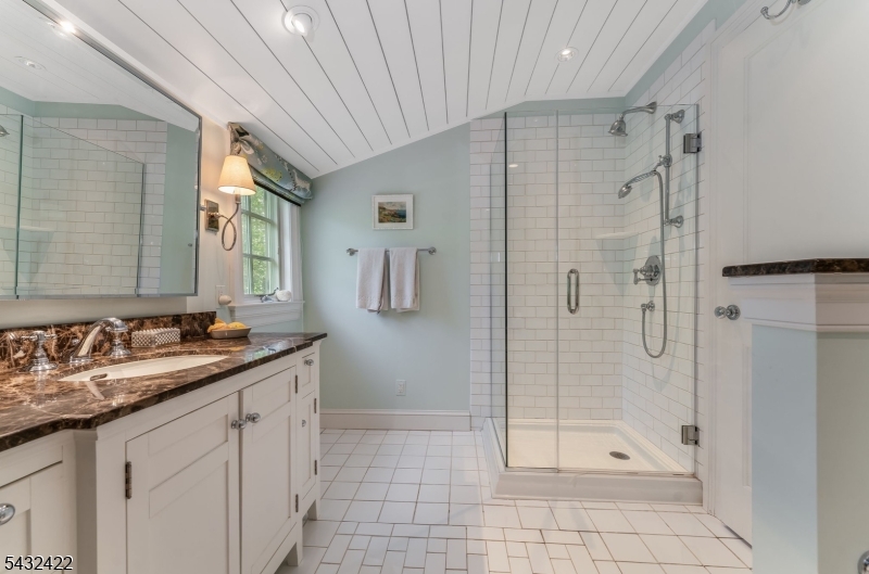 11 New Street Mendham, NJ 07945 - Photo 23 of 35 a bathroom with a granite countertop sink a mirror a glass door a glass door shower and a mirror