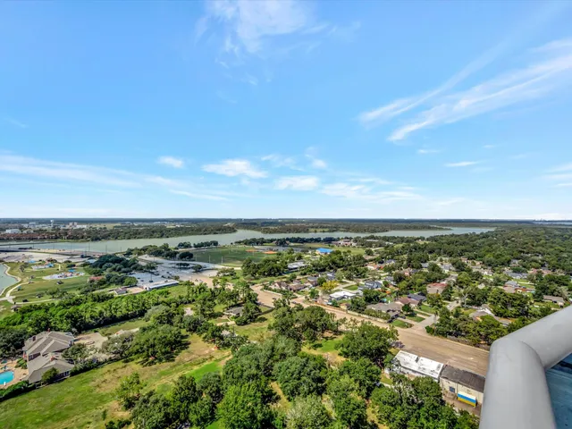 an aerial view of residential building and trees around