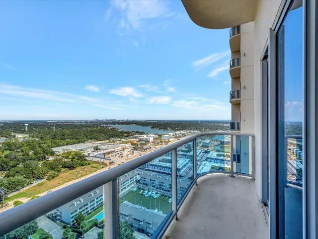 a view of balcony with city