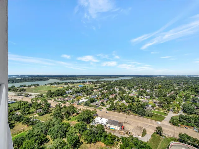 an aerial view of residential building and trees