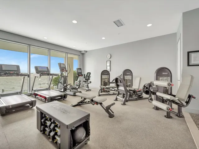 a very nice looking living room with furniture a air conditioner and a window