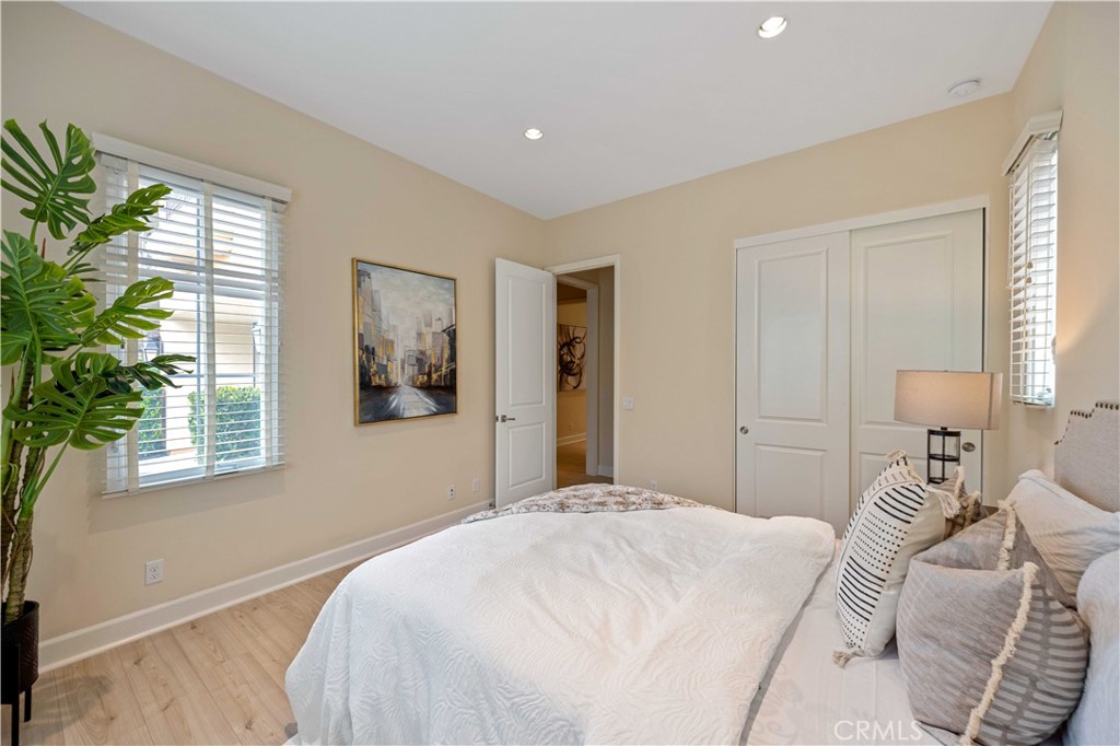 73 Copper Mine Irvine, CA 92602 - Photo 22 of 35 a bedroom with a large bed and a window