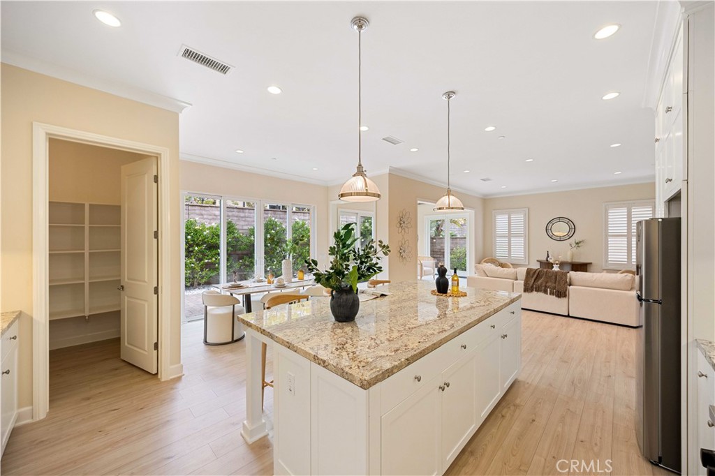 73 Copper Mine Irvine, CA 92602 - Photo 10 of 35 a living room with furniture and a floor to ceiling window