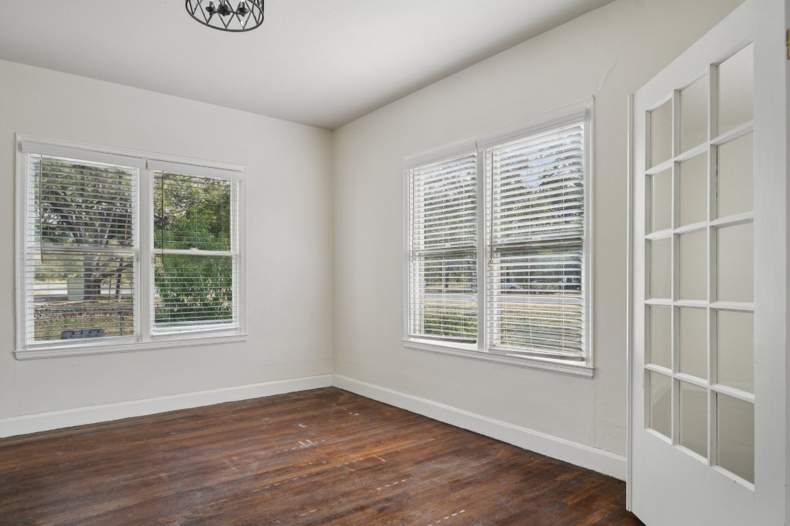 308 Taylor Road Elgin, TX 78621 - Photo 11 of 29 Unfurnished room featuring dark wood-style flooring and baseboards