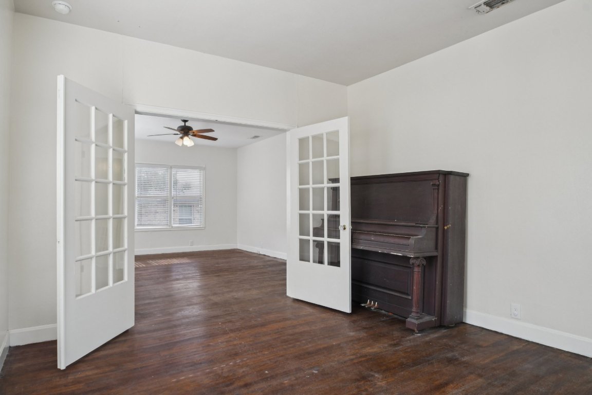 308 Taylor Road Elgin, TX 78621 - Photo 14 of 29 Spare room with dark wood-style flooring, a ceiling fan, and french doors