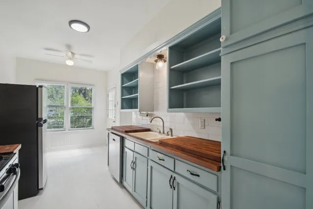 a bathroom with a sink double vanity and a shower