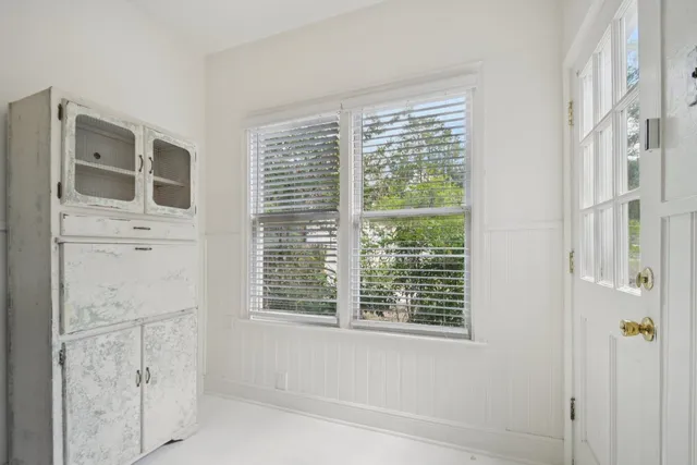a view of a bedroom with windows