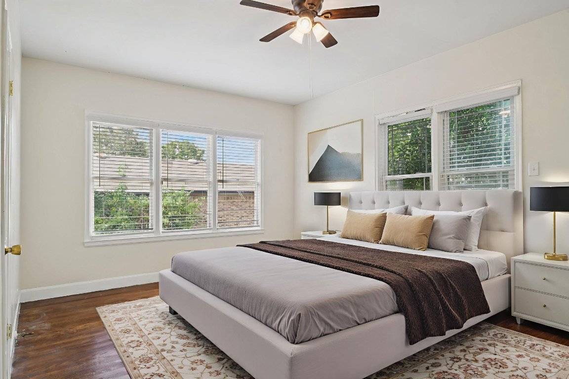 308 Taylor Road Elgin, TX 78621 - Photo 18 of 29 Bedroom with multiple windows, dark wood-type flooring, and a ceiling fan