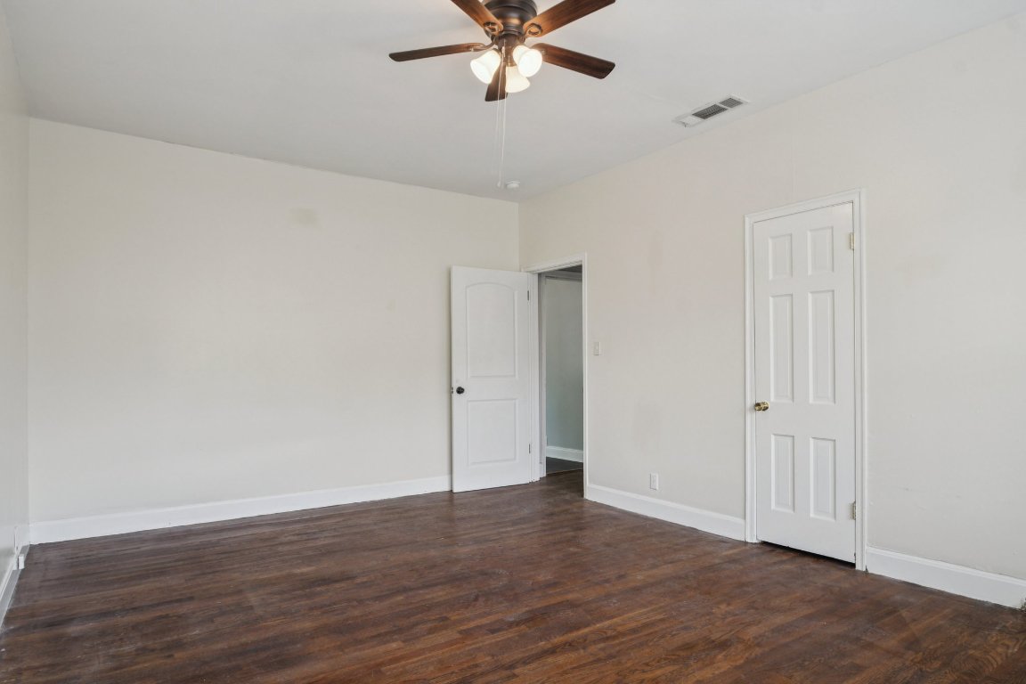 308 Taylor Road Elgin, TX 78621 - Photo 20 of 29 Unfurnished bedroom with dark wood-style floors and a ceiling fan