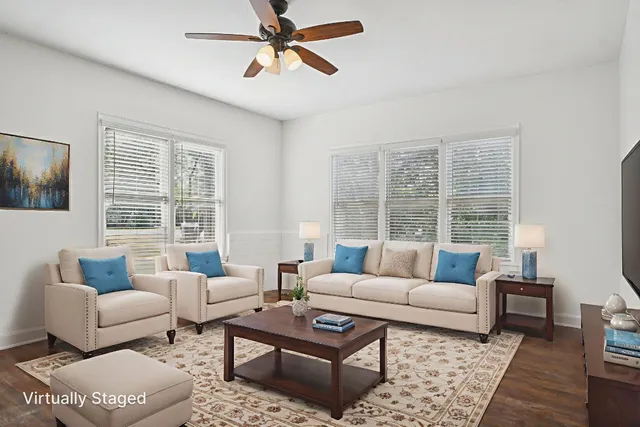 a living room with furniture and a large window