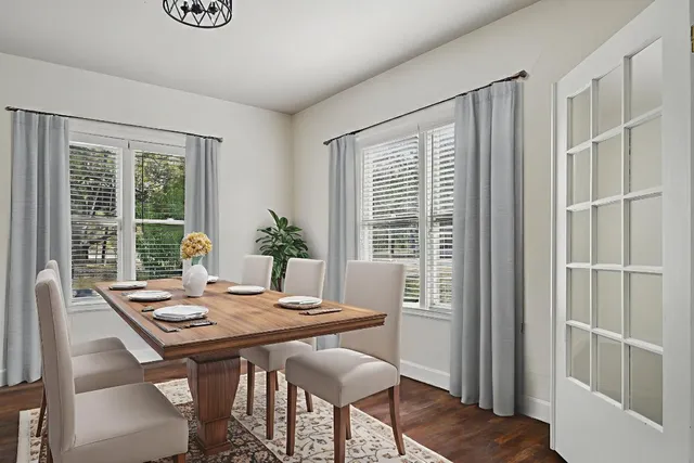 a view of a dining room with furniture window and outside view