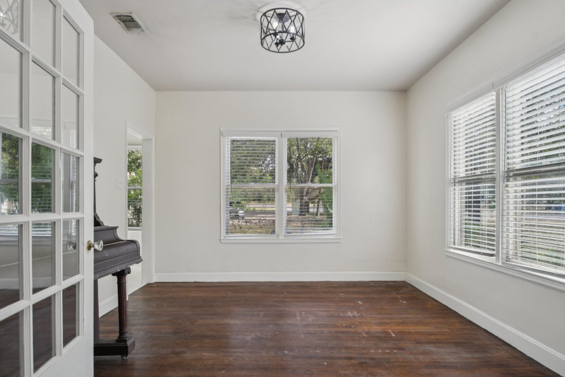 308 Taylor Road Elgin, TX 78621 - Photo 10 of 29 Spare room with dark wood finished floors and baseboards