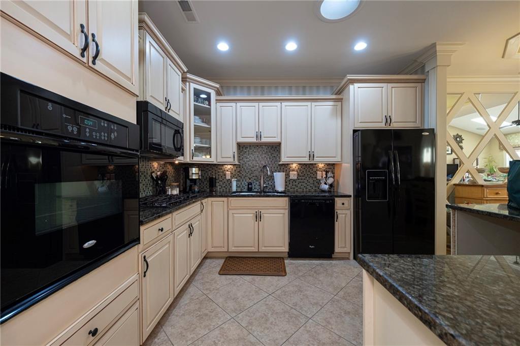 408 Independence Lane Freedom, PA 15042 - Photo 4 of 26 a kitchen with stainless steel appliances granite countertop a refrigerator a sink and dishwasher