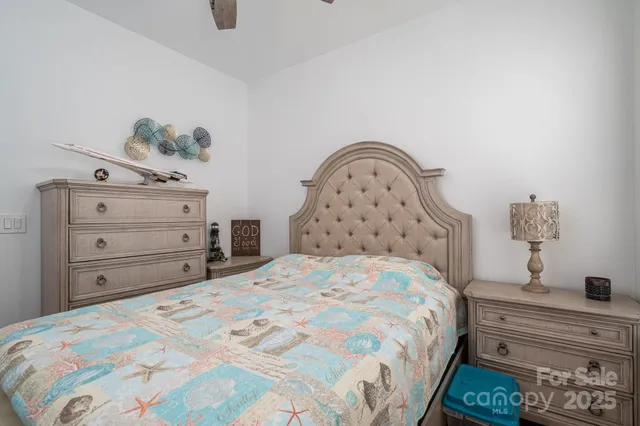 a bedroom with a bed and a dresser