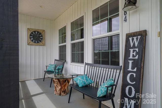 a view of a dining room with furniture and front door