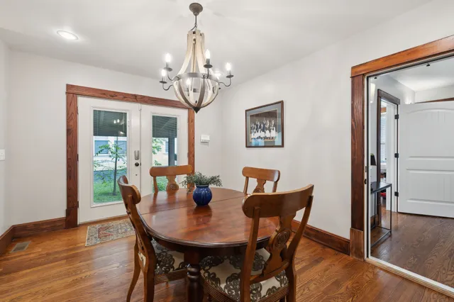 a kitchen with stainless steel appliances granite countertop a refrigerator a stove a sink and a refrigerator