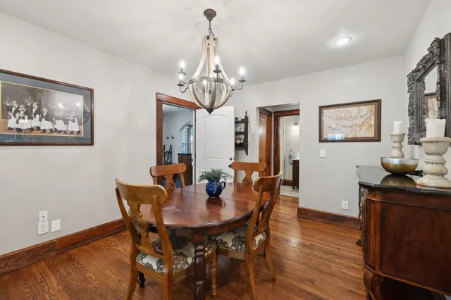 a kitchen with kitchen island granite countertop a sink stove and cabinets