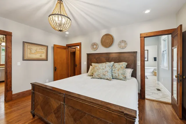 a bathroom with a sink vanity mirror and toilet