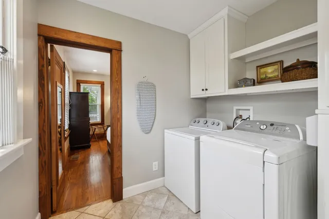 a bathroom with a sink vanity toilet and shower
