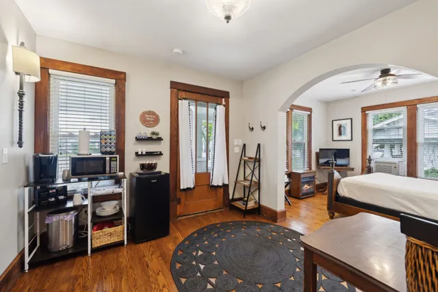 a view of a livingroom with furniture and a window