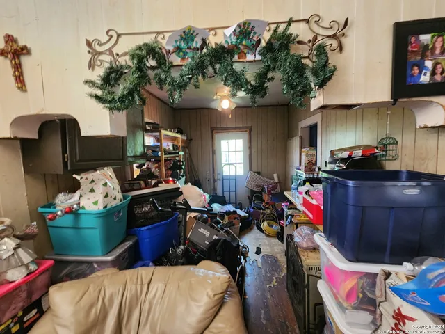 a room filled with furniture and a potted plant