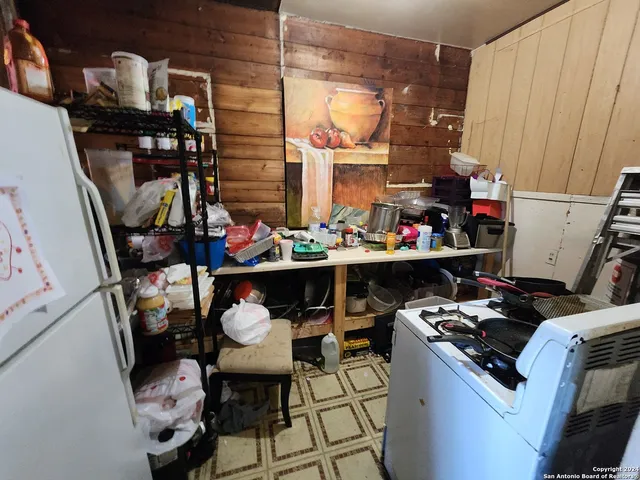 a view of a dining room with many windows