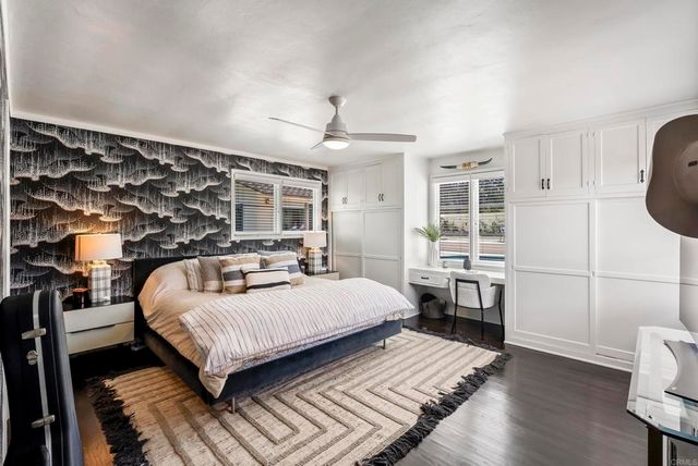 a room with a bed and a table in it