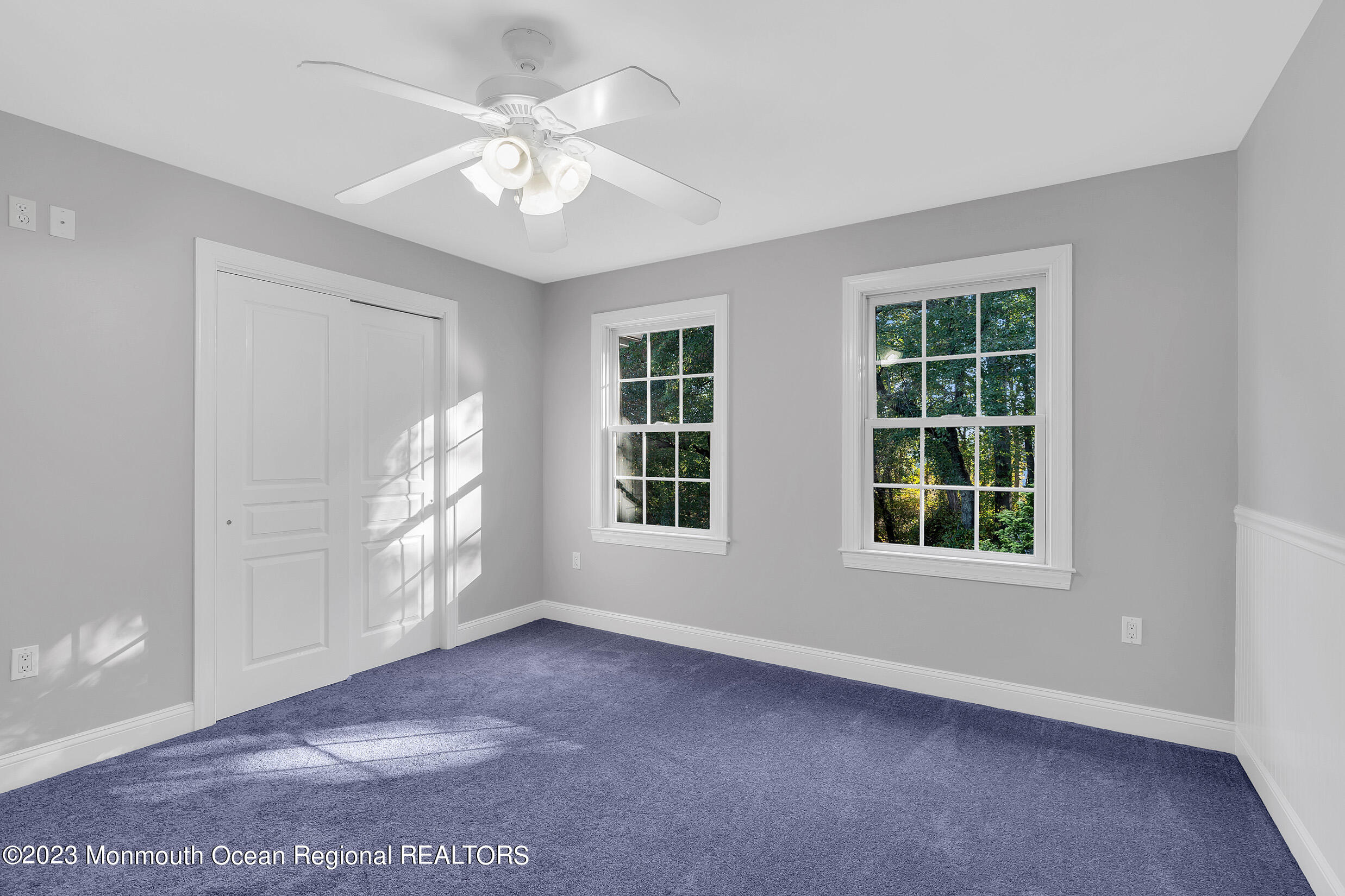 990 Farmingdale Road Jackson, NJ 08527 - Photo 28 of 67 an empty room with windows and chandelier fan