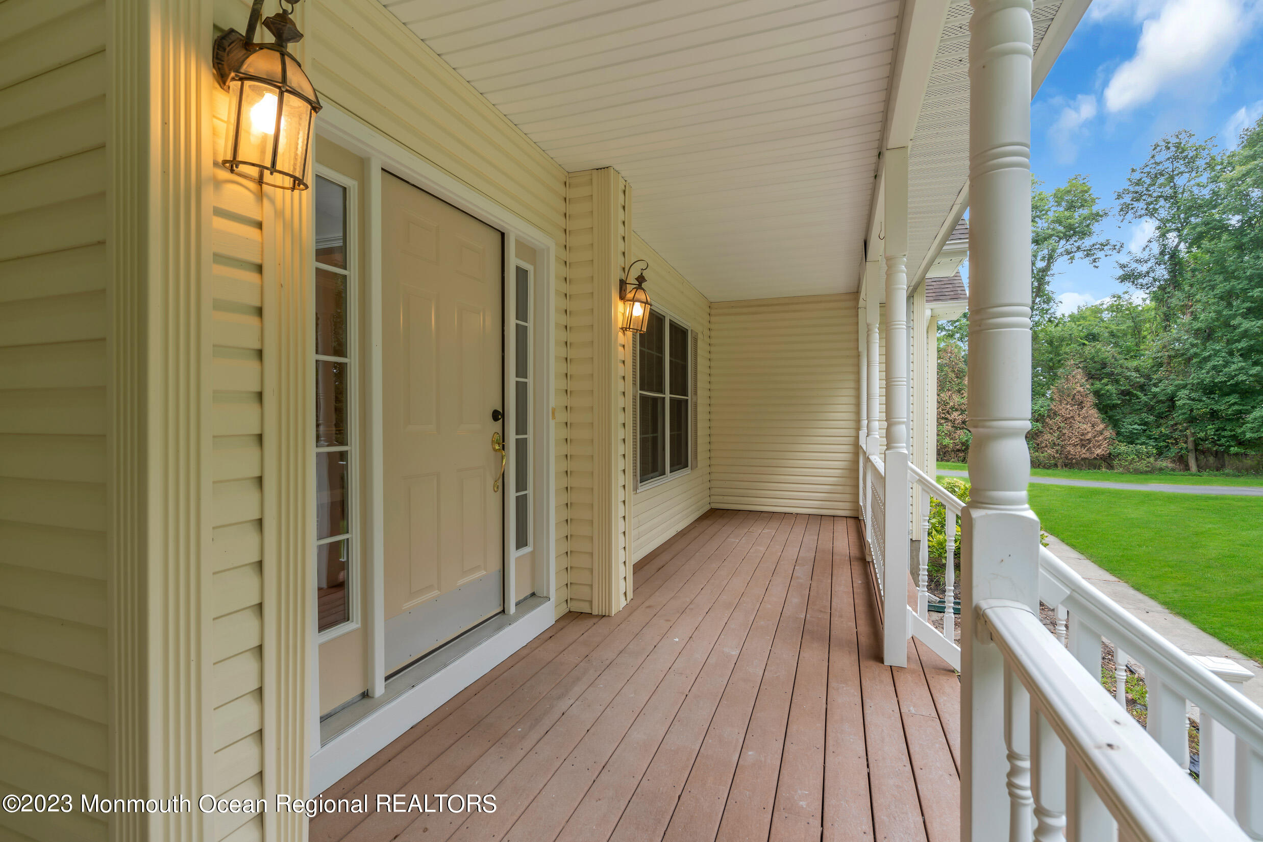 990 Farmingdale Road Jackson, NJ 08527 - Photo 3 of 67 a view of a porch with wooden floor and fence