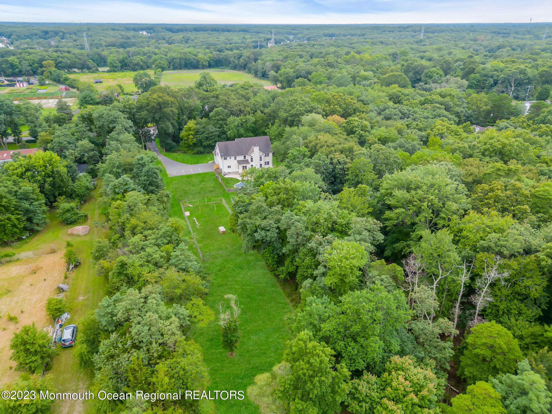 990 Farmingdale Road Jackson, NJ 08527 - Photo 54 of 67 an aerial view of residential house with outdoor space and trees all around