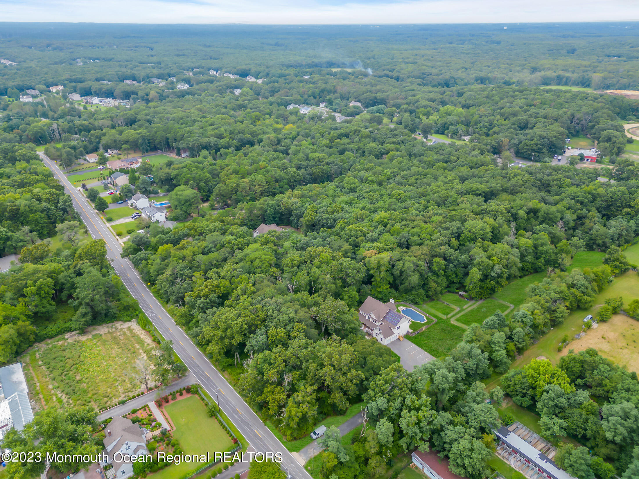 990 Farmingdale Road Jackson, NJ 08527 - Photo 60 of 67 an aerial view of residential houses with outdoor space and trees