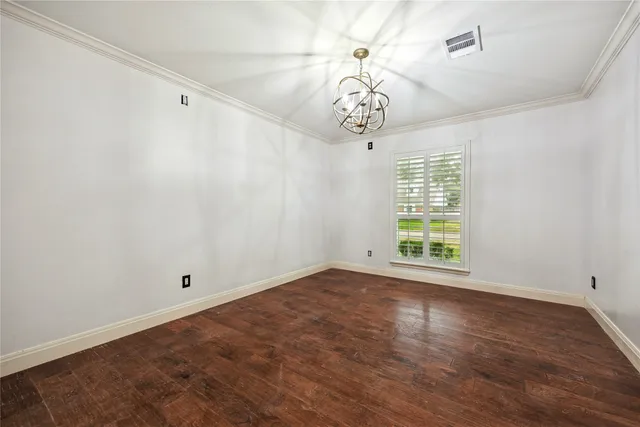 a spacious bathroom with a double vanity sink and mirror