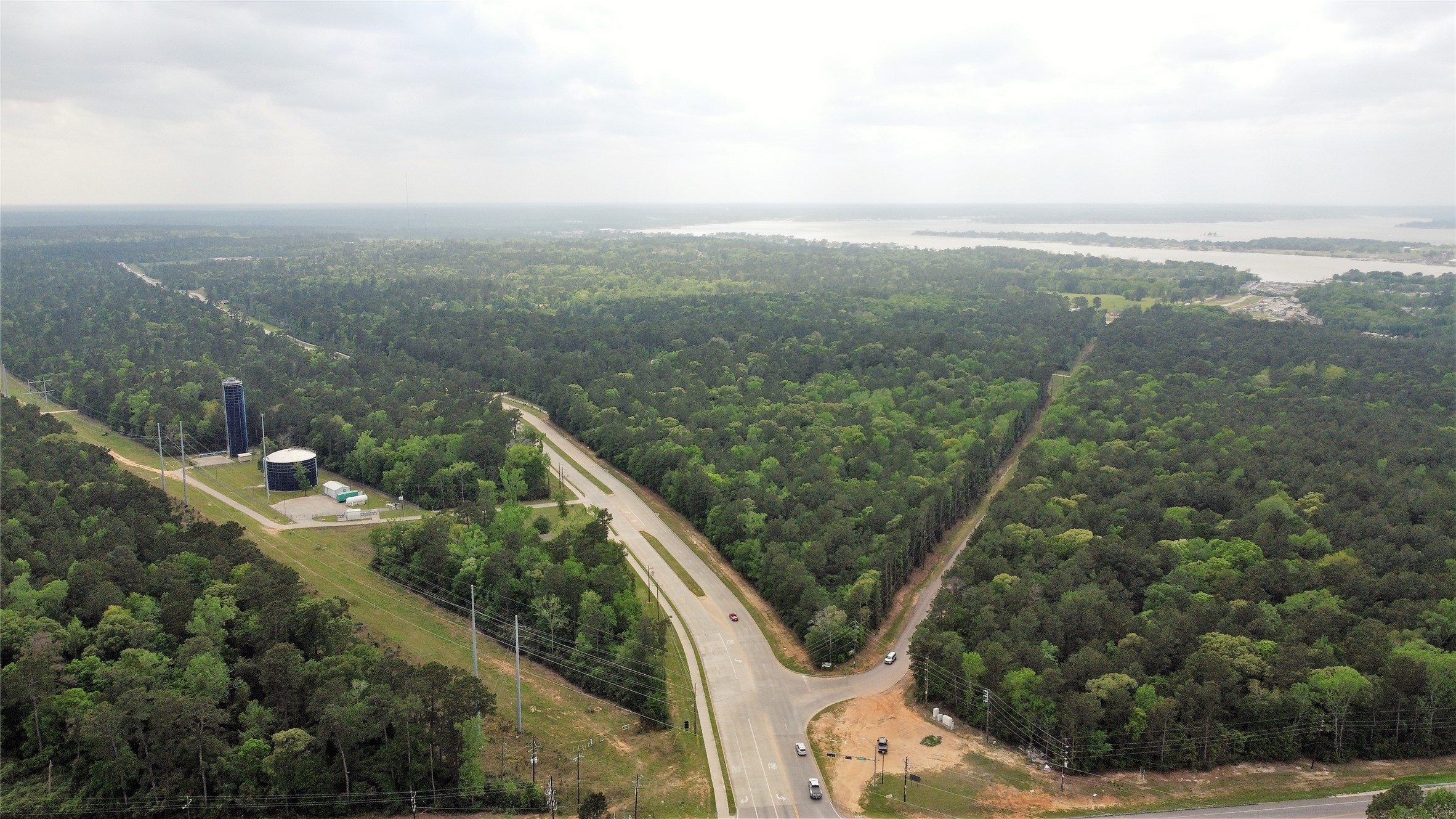 0 Fm 830 Conroe, TX 77304 - Photo 7 of 10 a view of a city with lush green forest