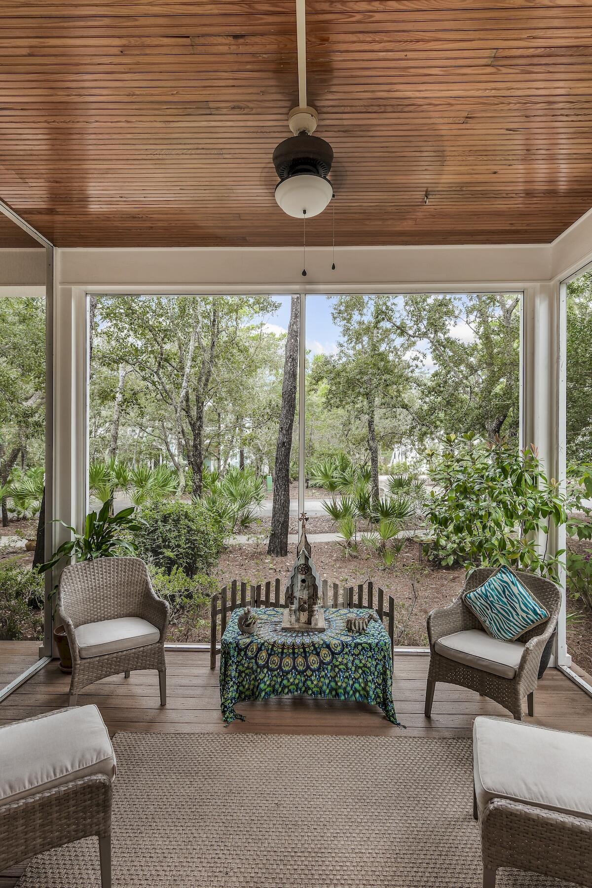 304 Wilderness Way Santa Rosa Beach, FL 32459 - Photo 12 of 48 a living room with patio furniture and a floor to ceiling window