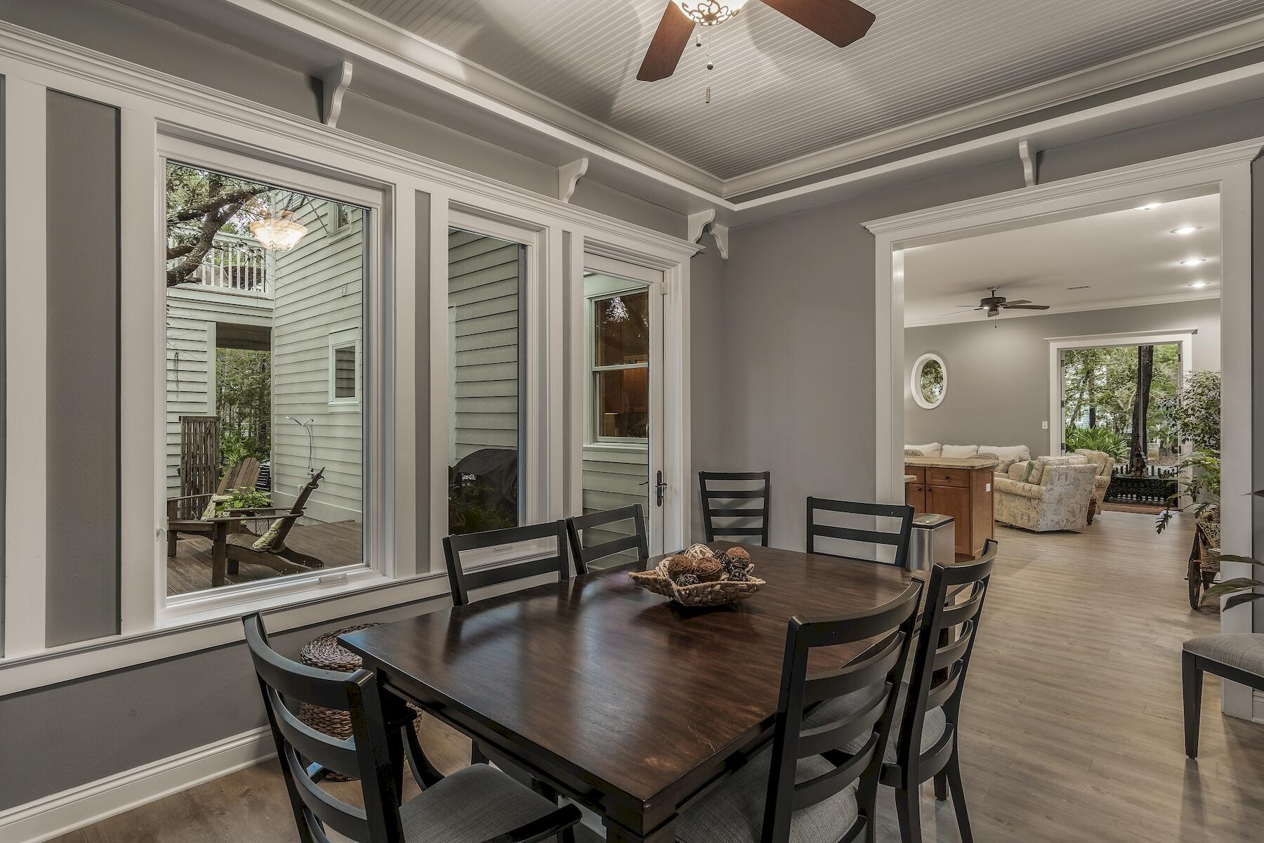 304 Wilderness Way Santa Rosa Beach, FL 32459 - Photo 20 of 48 a view of a dining room with furniture and window