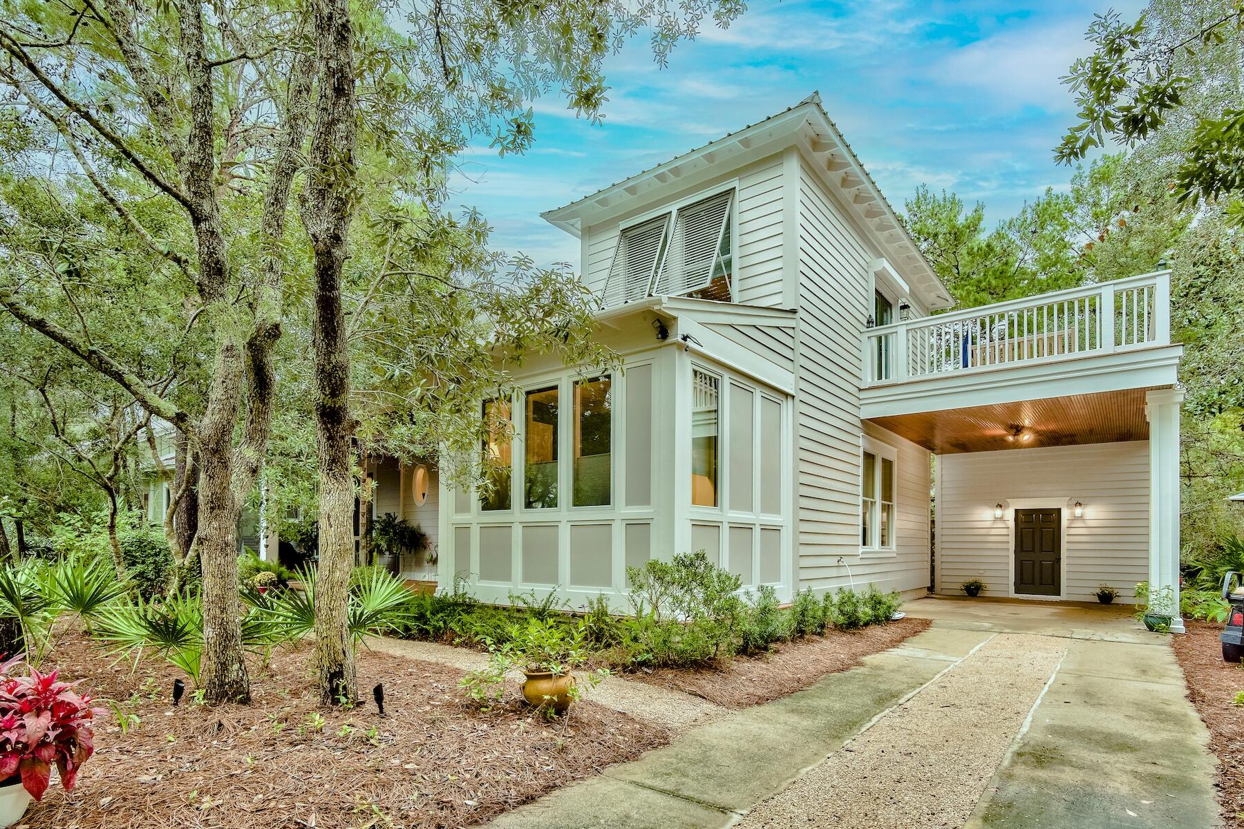 304 Wilderness Way Santa Rosa Beach, FL 32459 - Photo 2 of 48 a front view of a house with garden
